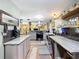 Long kitchen featuring granite countertops, stainless steel appliances, and wood look flooring at 2912 Case Ave, Bradenton, FL 34207