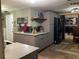 Well-lit kitchen featuring gray cabinets, stainless steel appliances, and wood look tile flooring at 2912 Case Ave, Bradenton, FL 34207