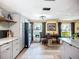 Kitchen area with stainless appliances, light-grey cabinets, butcher block tile floor, and adjacent work area at 2912 Case Ave, Bradenton, FL 34207