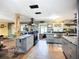 Renovated kitchen boasts stainless appliances, granite counters, and custom wooden support beam at 2912 Case Ave, Bradenton, FL 34207