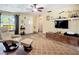 Inviting living room features a ceiling fan and wood-look flooring at 2912 Case Ave, Bradenton, FL 34207