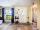 The inviting living room features hardwood floors, a decorative window, and a bright front door at 2912 Case Ave, Bradenton, FL 34207