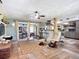 The open-concept living room features hardwood floors, a ceiling fan and ample space for relaxing and entertaining at 2912 Case Ave, Bradenton, FL 34207