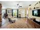 Inviting living room with ceiling fan, light yellow walls and wood-look flooring at 2912 Case Ave, Bradenton, FL 34207