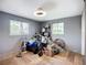 Room with wood-look tile floor, gray walls and two large windows with views to the exterior at 2912 Case Ave, Bradenton, FL 34207
