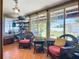 Enclosed sun room features terra cotta tile, bright natural light, and comfortable wicker furniture at 2912 Case Ave, Bradenton, FL 34207