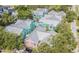 Colorful condo community boasts a pool, mature landscaping, and metal roofs at 3002 W Cleveland St # C3, Tampa, FL 33609