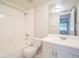 Clean bathroom featuring a shower-tub combo, white toilet, and single sink vanity at 3002 W Cleveland St # C3, Tampa, FL 33609