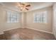 Spacious bedroom with dual windows for natural light and a ceiling fan at 3002 W Cleveland St # C3, Tampa, FL 33609