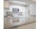 The kitchen features light gray counter tops with white cabinets and appliances at 3002 W Cleveland St # C3, Tampa, FL 33609