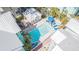 Aerial view of the pool surrounded by colorful condos and tropical landscaping at 3002 W Cleveland St # C3, Tampa, FL 33609