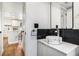 Stylish half bathroom featuring marble sink, waterfall faucet, and modern design at 3019 Park N St, St Petersburg, FL 33710
