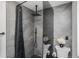 This shower features gray stone tile, glass partition, and rainfall shower head at 3019 Park N St, St Petersburg, FL 33710