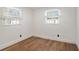 The bedroom has hardwood flooring and plenty of sunlight from two windows at 3019 Park N St, St Petersburg, FL 33710