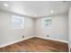 A bedroom with hardwood flooring, and two large windows providing lots of sunlight at 3019 Park N St, St Petersburg, FL 33710