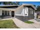 Single-story home with black brick accents, fresh paint, and well-manicured lawn at 3019 Park N St, St Petersburg, FL 33710