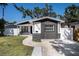 Charming single-story home with black brick accents, fresh paint, and well-manicured lawn at 3019 Park N St, St Petersburg, FL 33710