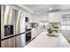 Bright kitchen features stainless steel appliances, modern cabinetry and white countertops at 3019 Park N St, St Petersburg, FL 33710