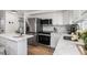 Bright kitchen features stainless steel appliances, modern cabinetry and white countertops at 3019 Park N St, St Petersburg, FL 33710