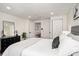 Bright main bedroom features stylish decor, a comfortable queen bed, and hardwood floors at 3019 Park N St, St Petersburg, FL 33710