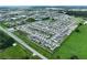 Expansive aerial view of a well-planned community featuring modern homes, landscaped streets, and serene lakes at 34056 Scarlet Sage Ct, Wesley Chapel, FL 33545