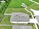 Aerial view of the home showcasing its spacious backyard, landscaping, and neighborhood amenities at 34056 Scarlet Sage Ct, Wesley Chapel, FL 33545