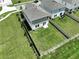 Aerial view of a home showcasing a spacious fenced backyard at 34056 Scarlet Sage Ct, Wesley Chapel, FL 33545