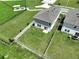 Aerial view of the backyard, showcasing the fence and proximity to neighborhood amenities at 34056 Scarlet Sage Ct, Wesley Chapel, FL 33545