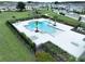 Resort-style community pool with lounge chairs, palm trees, and ample space for relaxation and recreation at 34056 Scarlet Sage Ct, Wesley Chapel, FL 33545