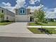 Charming two-story home with well-kept front yard and driveway at 34056 Scarlet Sage Ct, Wesley Chapel, FL 33545