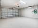Spacious two-car garage with epoxy flooring and climate control at 34056 Scarlet Sage Ct, Wesley Chapel, FL 33545