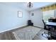 A modern home office featuring a work desk, comfortable chair, and sleek storage cabinets at 34056 Scarlet Sage Ct, Wesley Chapel, FL 33545