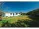 Backyard view with a well-maintained lawn at 3614 Vasco St, Punta Gorda, FL 33950