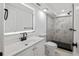 Modern bathroom features a sleek vanity and a tiled walk-in shower with black accents at 3614 Vasco St, Punta Gorda, FL 33950