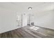 Bright bedroom features wood-look flooring and adjacent bathroom at 3614 Vasco St, Punta Gorda, FL 33950