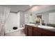 Elegant bathroom featuring a double vanity with granite countertops, a spacious walk-in shower, and neutral decor for a clean aesthetic at 4015 86Th E St, Palmetto, FL 34221