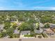 Wide aerial shot of a neighborhood showcasing houses, green trees, and street layouts at 4019 W Bay To Bay Blvd, Tampa, FL 33629
