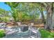 Inviting backyard with a firepit and chairs, perfect for outdoor gatherings at 4019 W Bay To Bay Blvd, Tampa, FL 33629