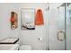 Bright bathroom with a glass shower, a modern vanity, and a framed automotive art piece at 4019 W Bay To Bay Blvd, Tampa, FL 33629