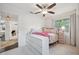 Bright bedroom with neutral colors, soft textures, a ceiling fan, and lots of natural light at 4019 W Bay To Bay Blvd, Tampa, FL 33629