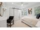 Light-filled bedroom with modern furnishings, including a vanity area and mirrored accents at 4019 W Bay To Bay Blvd, Tampa, FL 33629