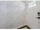 Entryway with wallpaper accent wall and white door with glass inserts at 4019 W Bay To Bay Blvd, Tampa, FL 33629