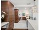 Modern kitchen featuring wood cabinets, stainless steel appliances and a bright window at 4019 W Bay To Bay Blvd, Tampa, FL 33629