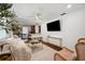 Open living room with modern decor, sleek furniture, and a stylish bar area at 4019 W Bay To Bay Blvd, Tampa, FL 33629