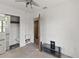 Bedroom with a built-in closet with drawers, ceiling fan, and damaged flooring at 410 73Rd Ave, St Pete Beach, FL 33706