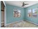 Bright bedroom features two windows and ample space with a closet on the adjacent wall at 410 73Rd Ave, St Pete Beach, FL 33706