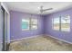 Empty bedroom featuring hardwood flooring and natural light streaming through large windows at 410 73Rd Ave, St Pete Beach, FL 33706
