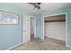 Cozy bedroom features closet, large door, and ample space with natural light at 410 73Rd Ave, St Pete Beach, FL 33706