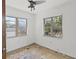 A bedroom featuring natural light from two windows and a ceiling fan at 410 73Rd Ave, St Pete Beach, FL 33706