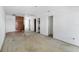 Empty living room featuring hardwood flooring and natural light streaming through doorways at 410 73Rd Ave, St Pete Beach, FL 33706